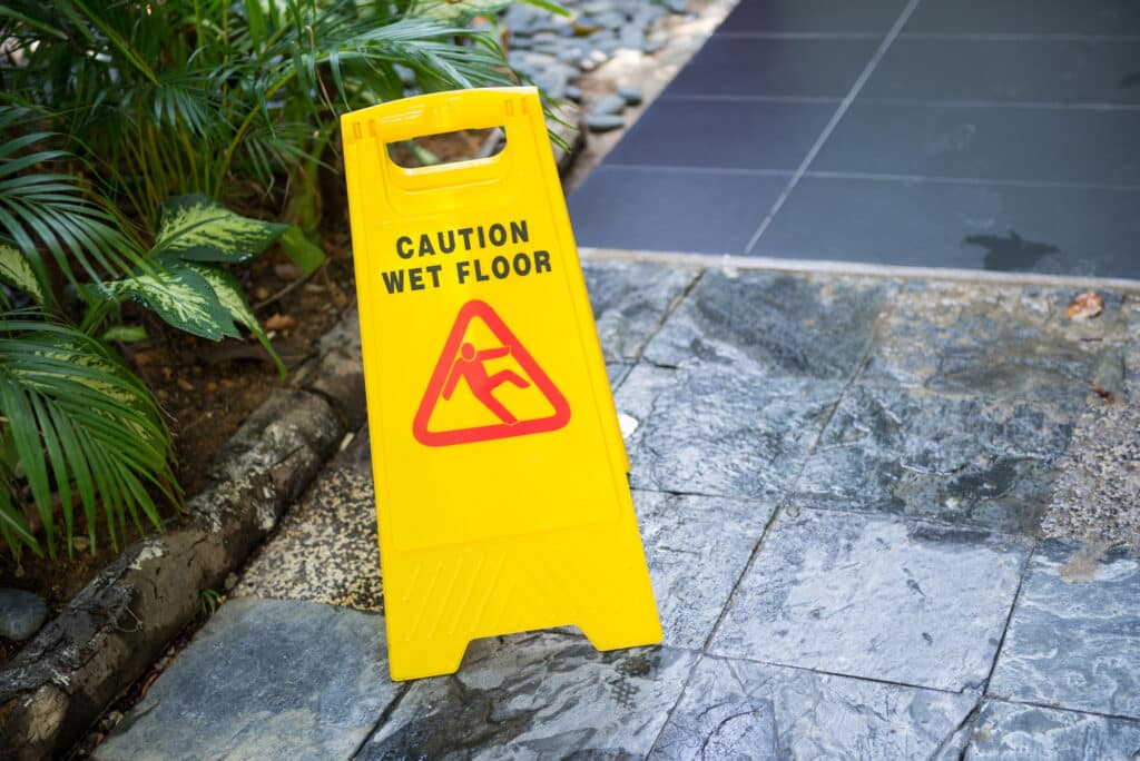 Slip and Fall Lawyer Fairfax VA - Sign showing warning of caution wet floor